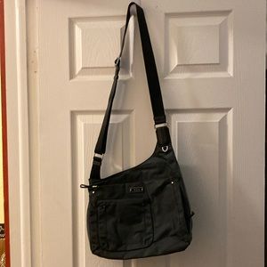 TUMI crossbody travel bag.